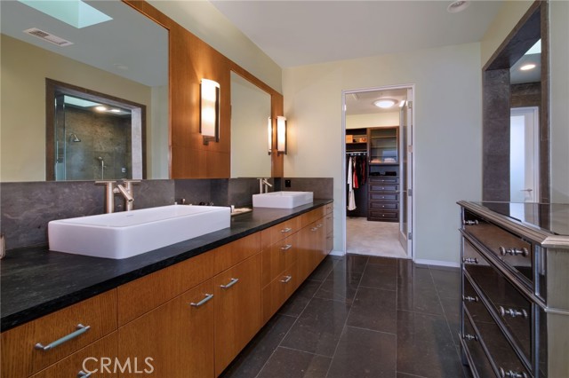 Spacious master bathroom with dual sinks and walk-in closet.