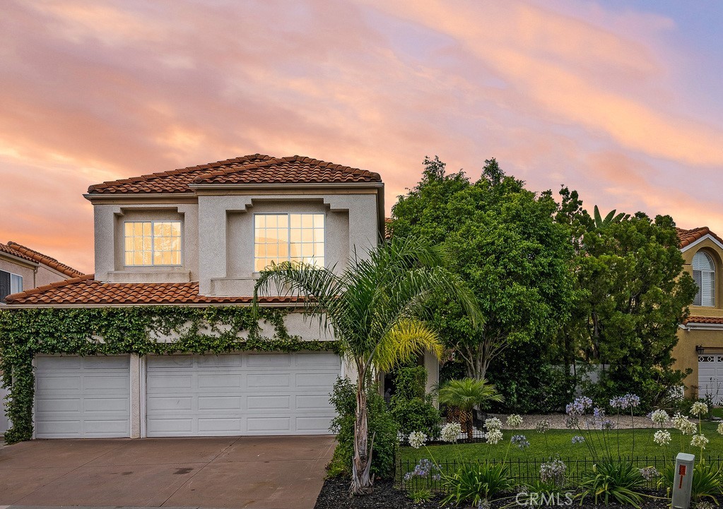 Welcome to your dream home in the sought-after Niguel Ranch area of Laguna Niguel! Completely remodeled and upgraded, this residence is stunning and situated on an oversized premium lot offering unparalleled privacy and gorgeous views. As you enter the home, you're greeted by an abundance of natural light streaming through the windows, highlighting the high, dramatic ceilings in the living room. The plantation shutters and luxury vinyl flooring throughout the downstairs create a stylish and cohesive look, perfect for any decor. The nearby dining room is spacious and ideal for hosting dinner parties or family gatherings. The remodeled kitchen is a chef’s dream, featuring Quartz countertops, glossy subway tile backsplash, stainless steel appliances, 12 ft custom peninsula, upgraded pantry & white shaker soft close cabinets with gold hardware. Adjacent to the kitchen, the family room offers a warm and inviting space for relaxation and entertainment and features a custom 12 ft fireplace with herringbone subway tile, custom oak mantle and Quartz bar area with direct access to custom wine storage room & nearby custom floor to ceiling enclosed wine rack with programable finger touch entry. The luxurious primary bedroom boasts incredible panoramic city light views and features luxury vinyl flooring. The upgraded primary bathroom has been recently remolded and showcases porcelain tile flooring, Quartz countertops, soft close shaker cabinets, dual sinks, a separate soaking tub, a walk-in shower, and two walk-in closets.  The three additional bedrooms upstairs are well-appointed with newer vinyl flooring and mirrored closets. They share an upgraded bathroom with Quartz counters and a tub/shower combo beautifully upgraded with subway tile and new glass door. The expansive backyard is a private oasis, perfect for outdoor living and entertaining. The large patio provides ample space for dining and relaxation, while the oversized artificial lawn offers plenty of room for various activities, including the potential for a pool or possible ADU or just enjoying the beautiful sunset views out back. Located within walking distance to Hidden Hills Elementary School, nearby parks, and HOA tennis and basketball courts, this home is perfectly situated for convenience and recreation. With a low 1.01 tax rate, no Mello-Roos, & close proximity to beaches, beach trail, shopping, entertainment, & award-winning schools, this luxury home offers the best of Southern California living.