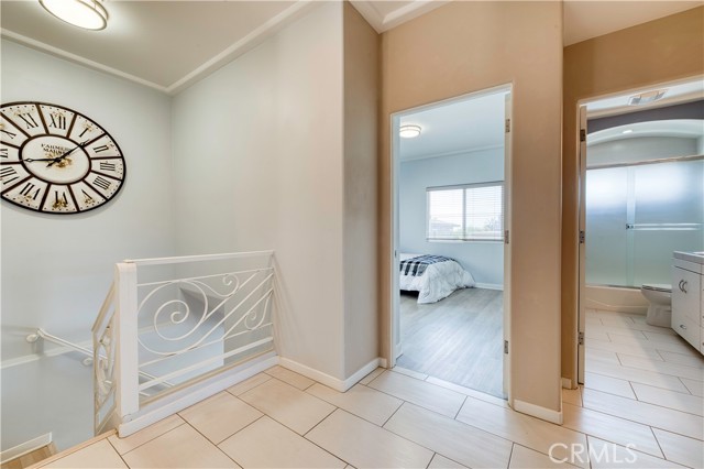 Stairs from mid level leading down to family room and 4th bedroom.