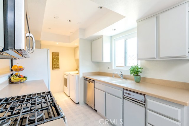 Spacious kitchen with Corian Counters and freshly painted cabinets