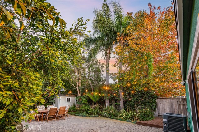 HUGE backyard with mature landscaping and room for your own personal vision. Note the incredible colors!  Storage she in the back could be a great playhouse or little office area.