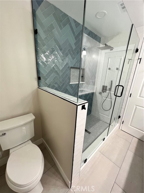 Secondary bathroom with semi-private toilet area