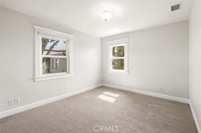 Bedroom 1. Dual pane windows and cellular shades.