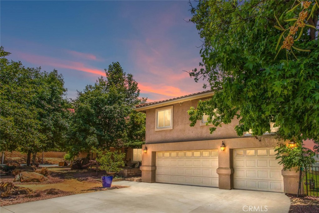 36383 Woodbriar Street Yucaipa, California Live away from it all in the ever so popular Wildwood Canyon area of Yucaipa. This amazing home has 5 bedrooms 2.5 baths Living room and family room complete with stone fireplace to warm up to on those cold winter nights. Formal dining room, country kitchen with corian counters, lots of cabinetry, double oven, stove top with hood and a spectacular view of the back yard. 1 large bedroom downstairs and 4 upstairs. The master suite is spacious and has a private balcony, dual sinks, tub and separate shower and walk-in closet. Also, a private balcony on the west side bedroom with has a gorgeous view of the valley. Covered patio is the full length of the back side of the house and is perfect for entertaining guests and family in your back yard. Inground swimming pool with spa and slide for the kids to play in. 3 car attached garage plus an additional 2 car garage for a home-based workshop/business. RV parking with hookups and a dumping station. The homeowner has paid thousands and thousands of dollars on Land and hardscape making the grounds ideal for enjoyment. Too many features to mention Please come by and take a look you will love this place.
