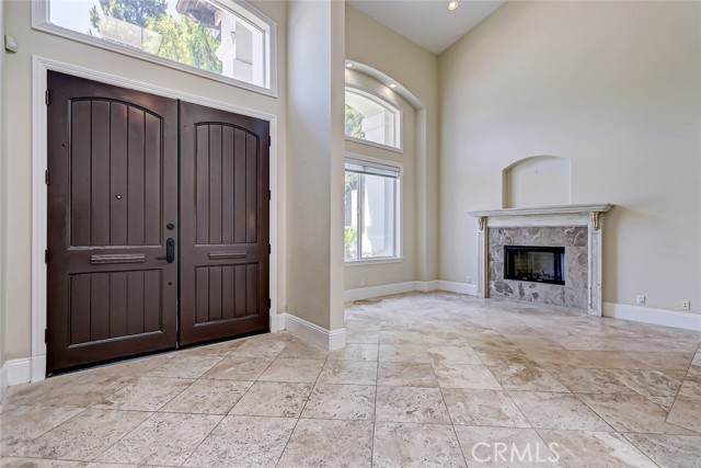 The entry of this spacious home is breathtaking with soaring ceilings and oversized windows - filled with light and style!