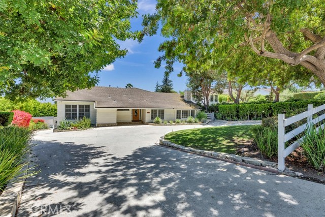Very discrete from the street. Parking for at least 10 vehicles in 1150 sqft garage and roundabout driveway.