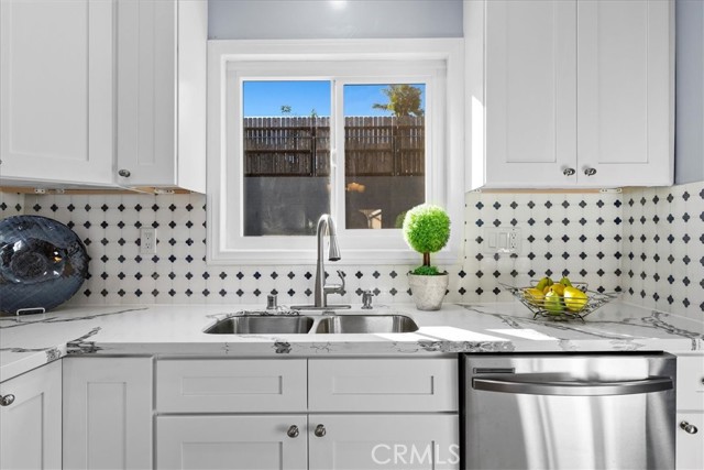 Kitchen with backyard view.