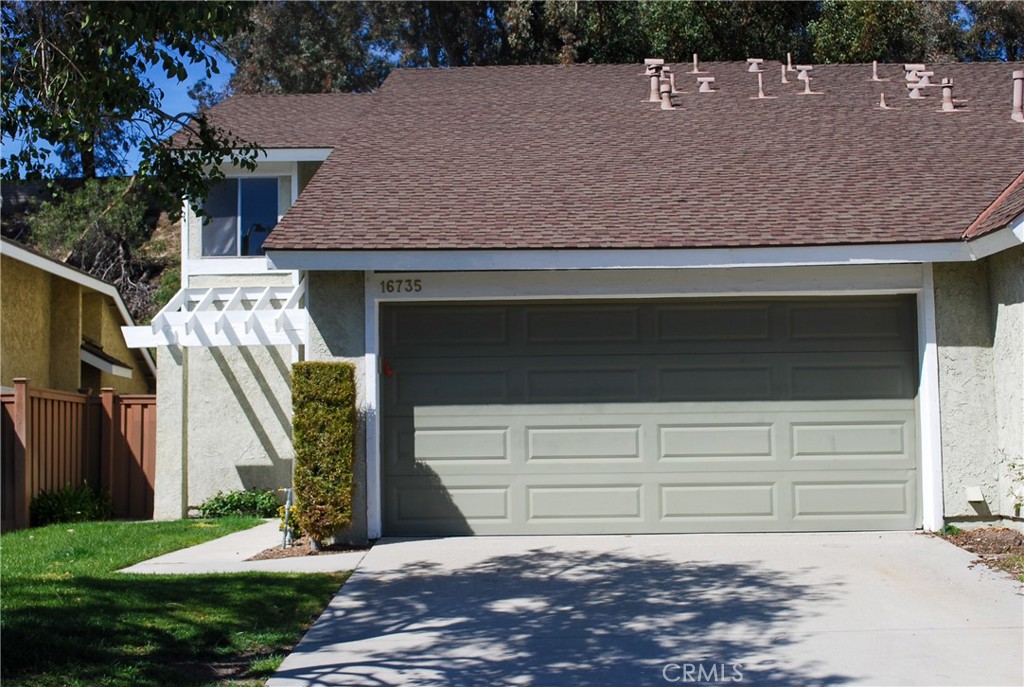 Welcome to the Stunning American Beauty Gardens Townhome in the serene Canyon Country!

This beautiful end-unit townhome features a freshly painted interior, new carpet, and a new stove. Situated on a peaceful, tree-lined cul-de-sac, it offers the perfect combination of privacy and modern charm, with only one shared wall, an attached two-car garage, and a spacious backyard that boasts no rear neighbors.

As you enter, you'll appreciate the fantastic floor plan, which includes a full bedroom and bath on the first level—ideal for guests or multi-generational living. The kitchen is elegantly designed with granite countertops and a stylish backsplash, perfect for culinary enthusiasts. The roomy family room, overlooking the dining area, is enhanced by laminate flooring and a cozy fireplace, while new carpet adds warmth to the upstairs.

Upstairs, you'll find two additional bedrooms that promote privacy and are filled with natural light. The primary suite is tucked away for added tranquility, and the second bedroom is positioned slightly apart for comfort. The upstairs landing leads to a generous balcony offering stunning hillside views—a perfect spot for relaxation.

Enjoy access to resort-style amenities within the community, including a pool, spa, tennis courts, and playground, all within a short stroll. Additionally, you'll appreciate the convenience of nearby grocery stores, Starbucks, and Cocos, all within walking distance, and being just minutes away from Costco, Target, fine dining, entertainment, and the 14 freeway for easy commuting.

Don’t miss your chance to make this stunning townhome your forever home!
