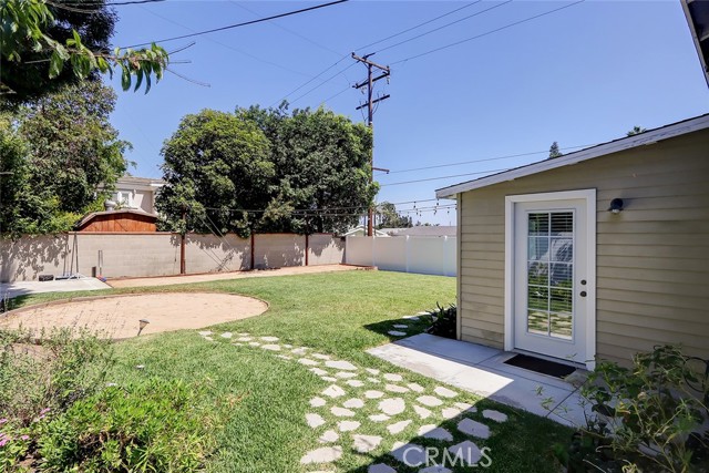 Exceptionally spacious rear yard with it's own bocce ball court!