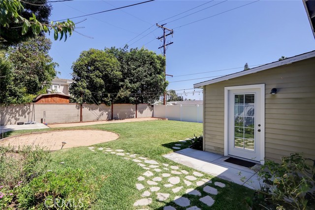 Exceptionally spacious rear yard with it's own bocce ball court!