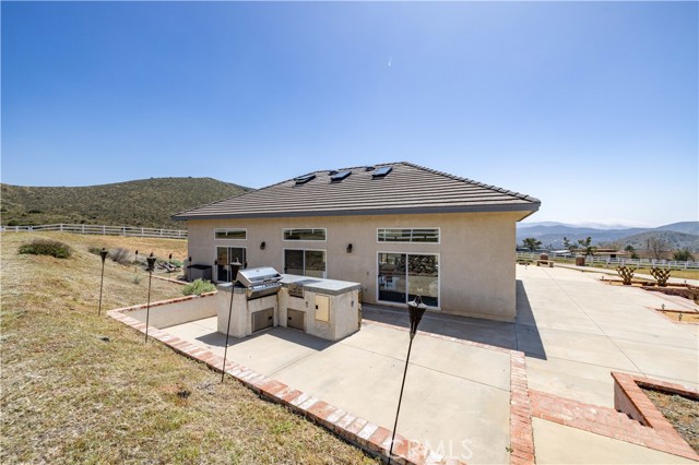 Rear of pool house with BBQ