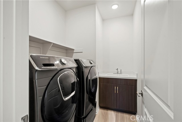 Laundry room with full sized washer and dryer