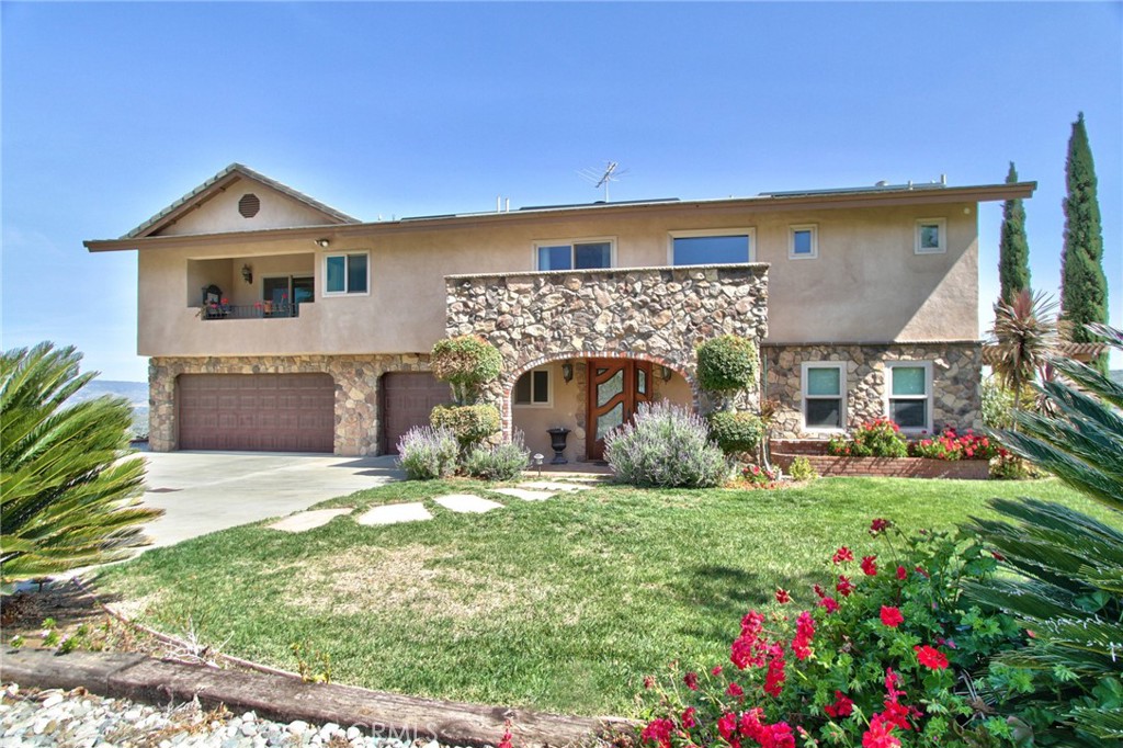 24380 Fuerte Road Temecula, California One of the most breathtaking views in De Luz. Stunning 4-bedroom 3-bathroom home on 10 acres with new 8+ kw solar subscription system and tesla charging station for vehicles. Home was updated in 2012. The downstairs has living room with travertine flooring plus 2 bedrooms with their own patios, 1 full bathroom with wheelchair access, laundry room and oversized 3 car garage. Upstairs is very light and open with wood floors, gourmet kitchen with custom cabinets, granite countertops and Thermador stainless steel appliances, wood burning stove, family room and dining room plus huge deck to enjoy the views and ocean breezes. Upstairs master suite has built in fireplace, bookshelves, custom walk-in closet. Master bathroom offers dual sinks, spa tub and separate shower. Additional bedroom upstairs with private balcony and separate bathroom. Wonderful family home or perfect for rental or AirBNB. NO HOA. Lush landscaping plus great cell and internet reception. Home is private yet easy access to downtown Temecula.