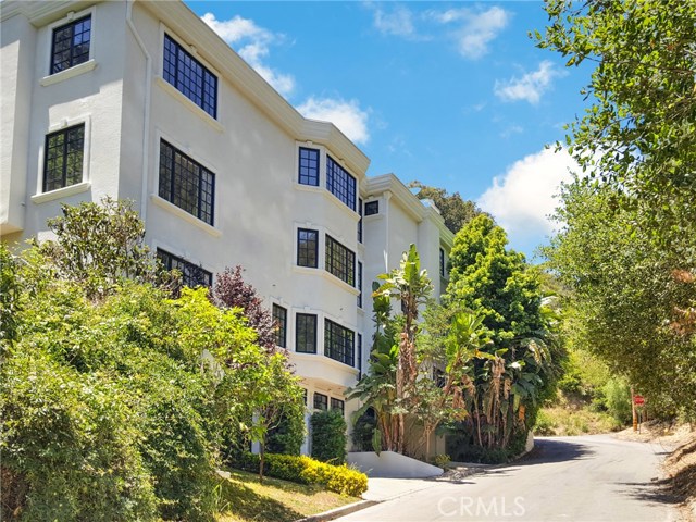 1398 N Davies Drive Beverly Hills, California Exquisite three story Mediterranean corner lot home located in the Beverly Hills Post Office area. This grand home features five bedrooms, 7 bathrooms and is approximately 6,274 sqft. The property has two separate entrances with elevator access on all three levels. The first entry way is a side door located directly to the right side of the three car garage which has no steps and leads you directly to the elevator and garage storage space. You can take the elevator or the stairs directly to the basement area of the home which has a large bonus room area, three bedrooms, a dry bar, sauna, walk in-shower to the sauna room and beautiful french doors leading out to your private pool and spa. The pool and spa were just re-plastered and the entire home was re-painted. The ground floor has a formal living room with views of the mountains and city lights with its own separate wet bar for entertaining. Gorgeous formal dining room area and a large Kitchen with a commercial grade refrigerator and breakfast nook that opens up to the family room. Each level has its own private balconies overlooking the extremely private pool and hilltop. The second level features two additional bedrooms, including a master bedroom that has two separate bathroom areas including a bidet, and two large walk-in closets. Amazing area only short five minutes to rodeo drive the Beverly Hills Hotel and much more. Don't miss out on this amazing price in a great area!