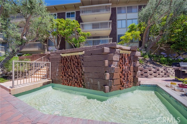 Water features throughout the community pool area