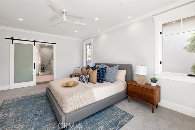 Master Bedroom with Sliding Glass Panels Leading to the Master Bath