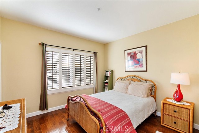 Upstairs bedroom with wood floors and walk-in closet
