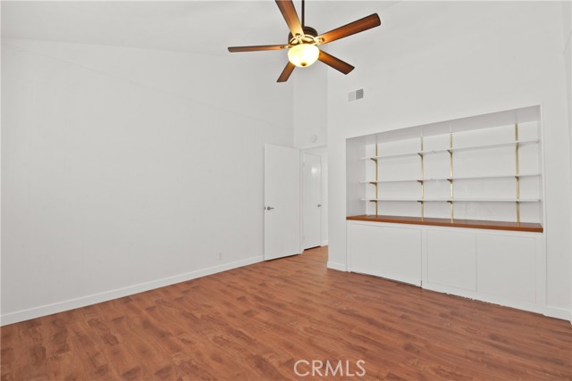 Front upstairs bedroom with shelves and cabinets