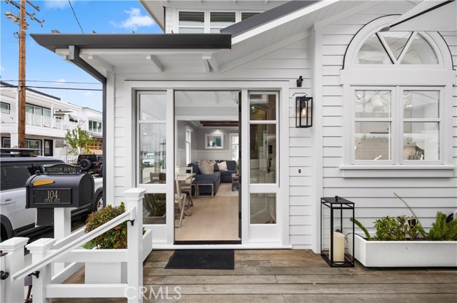 104 Onyx Avenue Newport Beach, California "One of a Kind" location. Outstanding rare and remarkable residence ideally situated just steps to the water on what was formerly the rear section of a South Bayfront lot that subdivided in 2003. This iconic and classically restored beach house is completely turnkey and is the only Balboa Island home on this kind of corner. This impeccable property provides an abundance of light, serene views of the Bay from both levels and picturesque details throughout. The main floor offers new white oak floors, an expansive living area, large master retreat and a gourmet kitchen with vaulted ceilings, new quartz countertops, fixtures and Wolf appliances. The first floor opens to an expansive outdoor patio with great views of the Bay. The second floor offers a private separate entrance, new white oak floors with a large bedroom, bath, storage, and spectacular views of the Bayfront. Not only is the location of this home rarely available, but it also affords the use of a short-term permit with fantastic rental history and that presents an array of options for the new owner. This luxury home has a new metal roof and approved plans for a large (10'x 20') upstairs deck. Ideally located just one block from Marine Avenue, enjoy easy access to the Island’s downtown shops, dining, and more. Don't miss out on this unique opportunity to obtain what was formerly a part of a Bayfront lot without the Bayfront price.