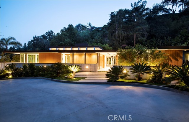 1061 Loma Vista Drive Beverly Hills, California Designed by master architect, Rex Lotery, FAIA, in 1959 and situated in the iconic Trousdale Estates, this mid-century masterpiece has been meticulously restored. Sparing no expense, design team Philippe Naouri and Eric Choi of Maison d'Artiste, in collaboration with Studio Tim Campbell, have fully reimagined this architectural treasure. Conceptualised for French actress Corinne Calvet in the 1950s and inspired by a chance meeting with Charlotte Perriand, Rex Lotery pulled out every artistic stop in his design to honor and maintain mid-century minimalism. While he may never have imagined the modern luxuries that have been adapted to fill this artful space, he no doubt would approve of the current adaptation and precision which has insured the integrity of the original design for years to come. 8,800 sqft of residential indulgence sitting on over half an acre of manicured landscaping inspired by Brazilian modernism, this home leaves no need unmet. An abundance of amenities surrounds six bedrooms and eight bathrooms. A seamless kitchen, screening room, temperature-controlled wine enclave, and zero-edge pool are among the indulgences that steep the energy of this space with modern luxury. The Calvet Residence offers the best of both worlds, historic and modern, and lends a living experience unparalleled by contemporary design.
