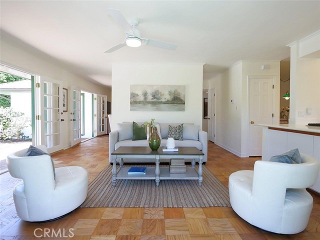 Family room is separated from the living room by the fireplace and adds more space for entertaining.