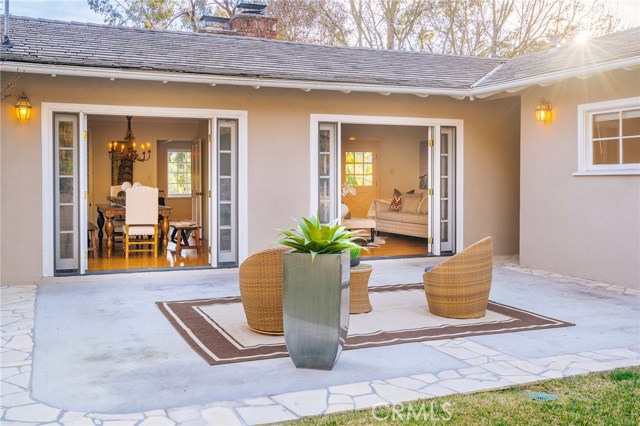 The backyard patio opens from the living room and dining room through French doors.