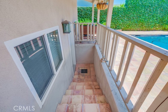 Stairs leading from backyard to downstairs bonus room