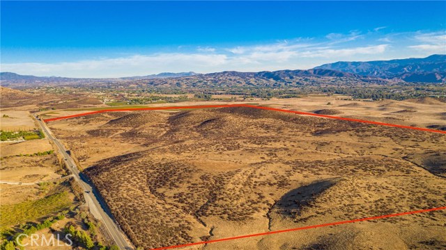Heart of Temecula Valley Wine Country. This 163 Acres is Adjacent to a large Planned Future Winery Resort Development & close to the entrance to Lake Skinner and in close proximity of Temecula Valleys Bustling Wineries and Resorts. This Property has Wine Country Zoning. Property is adjacent to Large County Habitat parcel and buyer should investigate status on this parcel. 

The topography is Varied, from Rolling to Hilly to Flat. room to plant vineyard and Panoramic Views  From the Hill tops you can see to Lake Skinner 
Water and Sewer is still a distance away.