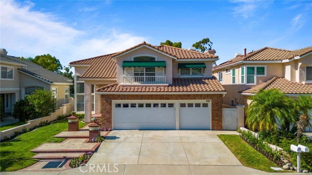 Welcome to this beautiful Anaheim Hills pool home located in the Summit Springs Community.  As you enter through the granite entryway, you'll be greeted by a generously sized living room with high ceilings that create an airy and open atmosphere, continuing into the dining room with French Doors that open to the backyard.  The interior is adorned with shutters, crown molding, recessed lighting and double pained windows that offer lots of natural light.  The open kitchen features a center island, walk in pantry and a abundance of windows that fills the room with warmth and brightness.  Off the kitchen is a large family room with fireplace and sliding doors that lead to the backyard with a pool and spa.  Main floor bedroom has an en-suite bathroom, half bathroom off the hallway and separate laundry room that leads to the 3 car garage with built in storage cabinets and electrical outlet for car charger.  Upstairs master bedroom with retreat and fireplace, walk in closets, master bathroom with dual vanities, tub and walk in shower.  Down the hall is another bathroom with shower, two more bedrooms that are separated by a Jack and Jill bathroom.  At the end of the hall is a bonus room (also can be used as a 5th bedroom).  Close to shopping centers, parks and hiking trails.