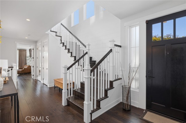 From the foyer.  That is the front door, the Primary bedroom is on the left.