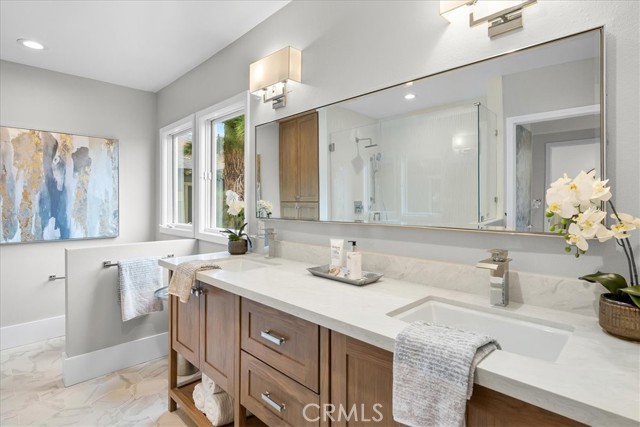 Dual sinks, large walk in shower and walk in closet in your master retreat.