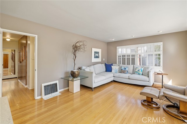 Spacious living room with hardwood floors