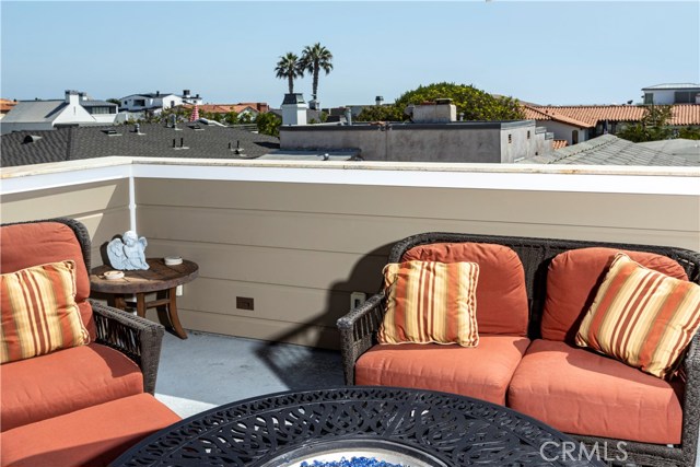 1577 Miramar Drive Newport Beach, California GREAT investment income property that affords opportunity for owner's use as a secondary residence as well. 30 Day Stay required with expected $15K per month. Situated in the most desired community on the Peninsula, you find this 4 bedroom, 4 bath home that is literally steps from the I Street Beach and steps from the bay. Built from ground up in 2016, the quality of construction boasts meticulous attention to detail and design throughout. This house represents the epitome of indoor/outdoor beach living at its finest. The open concept entry level includes a large family/living room with a cozy fireplace. The tri-fold glass patio doors open out to a inviting front patio. This home features a main level bedroom and gourmet kitchen complete with quartz counter-tops and Thermador stainless steel appliances plus a built-in refrigerator, 6-burner professional stove with pasta filler, two ovens and walk in pantry. Wired for sound, and data the 4K HDTV w/ Dolby Atmos Surround Sound system allow for a theater experience. All floor surfaces feature hardwood flooring. Master Suite features a large walk-in closet & master bath includes a beautiful soaking tub in addition to heated floors. Recessed LED lighting make this the perfect place to call home, or your home away from home. All rooms have Individual Energy Efficient Temperature Control with a central controller. Second floor laundry room and so much more. The Roof top deck provides stunning views perfect for entertaining.