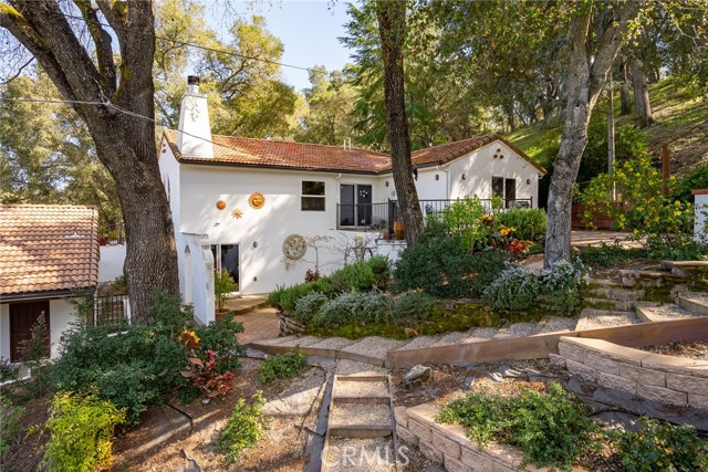 Divine backyard!  Past the garage we happen upon the captivating backyard.  There is lush landscaping and thoughtful pathways.