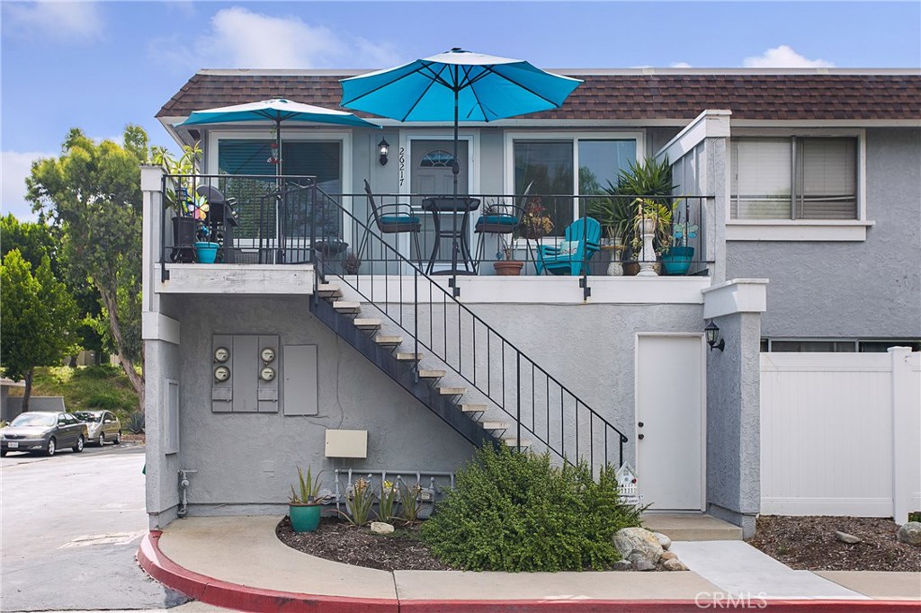 Welcome to 26217 Via Roble! This light and bright upstairs end unit is a must see! A spacious private patio welcomes you in to this lovely home with tons of upgrades! Some highlights you are sure to notice immediately are the new dual pane windows, luxury vinyl flooring throughout, recessed can lighting, scraped ceilings, newer neutral paint and open living layout. The galley style kitchen has a lovely eat in breakfast nook where you can enjoy the sunset views off the front patio. The kitchen also features resurfaced cabinet doors and new hardware as well as new stainless steel appliances and convection microwave. The laundry space is conveniently located just off the kitchen. As you walk down the hall, you will notice the new doors on the bedrooms and bathrooms. The master bedroom is generously sized and has a nice walk in closet. There are 2 new vanities that share a private tub/shower enclosure. Located within the highly sought after Aliso Villas community. One car garage and one designated space. Enjoy membership to Lake Mission Viejo for boating, beach, summer concerts and more! FHA Approved.