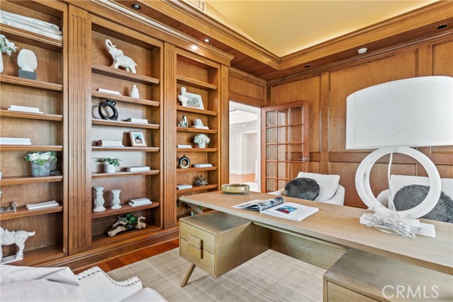 Wood-paneled office with built-in display.