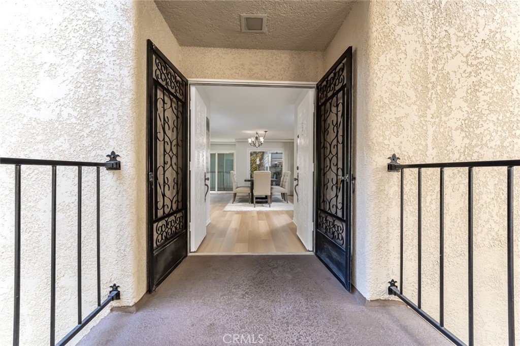 Welcome to this lovely very spacious "Garden Villa" unit in Laguna Woods!  This unit is truly a find! It is a highly upgraded 2 BR, 2 BA with 1335 SqFt of Beauty!  It is a much larger unit than most in the building! The Home has been completely freshly Painted, & has new Luxury Vinyl Plank Flooring (LVP) throughout the entire Unit! The Kitchen & both Bathrooms have been Remodeled also. The Primary Bedroom has an ensuite Bathroom with Vanity and Tub & Shower.  The Secondary Bathroom has a Designer Vanity with Mirror, lovely Vanity with Drawers & Cabinet. The Sunny Kitchen has overhead Lighting, Stainless Steel Appliances: Electric Range, Microwave, Refrigerator, Double Sink & a Pantry!!!  There are Dual Paned Windows throughout! The Extra-Long Living Room is truly extremely Spacious! Off Living Room and Formal Dining are a Big Window & 2 sets of Sliding Glass Doors onto the Charming Balcony which has a View of the Par 3 Golf Course. The Formal Dining Room is also very roomy! An enormous Gathering could be given in this oversized Living Area!!!! The unique Floorplan has the 2 Bedrooms very widely spread out from each other for privacy for guests and roommate situations. This is an elevator Building so no steps are necessary.  There is an over-sized Parking Spot for everyone which has room for a Car & a Golf Cart!  Off the Garage is a Recreation Room which can be used occupants & guests & the Mailroom is on that level as well!
Laguna Woods Village is Orange County's premier coastal guard gated 55+ age restricted community with over 200 clubs, 7 clubhouses, 5 pools 3 gyms, tennis, paddle tennis/Pickleball, library, free bus system, 27 holes of professional golf, a 9 hold par 3 course, driving range, RV parking, garden center, equestrian facilities, riding trails, Aliso Creek walk path, woodworking shop, sewing, ceramics, lapidary, art and emeritus classes and so much more.