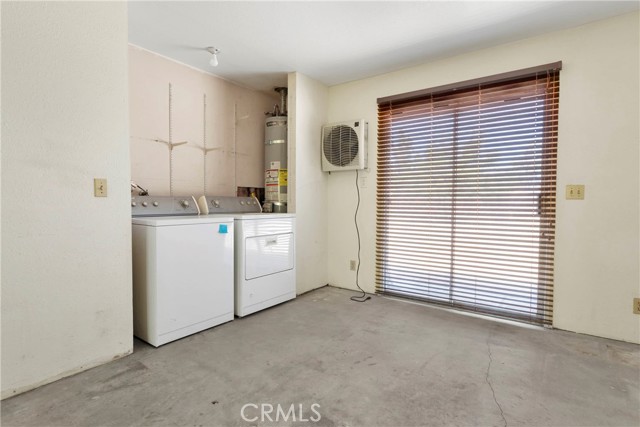 Laundry located inside huge bonus room (washer/dryer included) between kitchen and garage. Room was built with house.