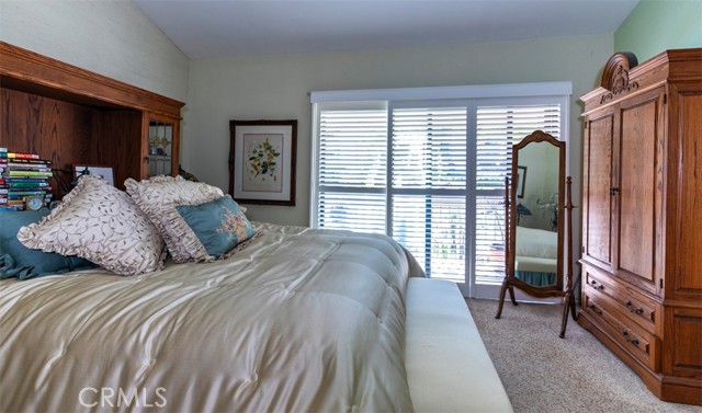 Sliding door to balcony with shutters