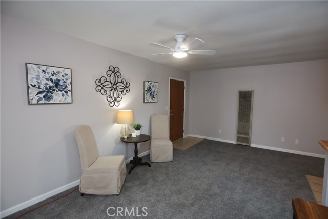 Second unit living room, fresh paint, carpet and ceiling fan