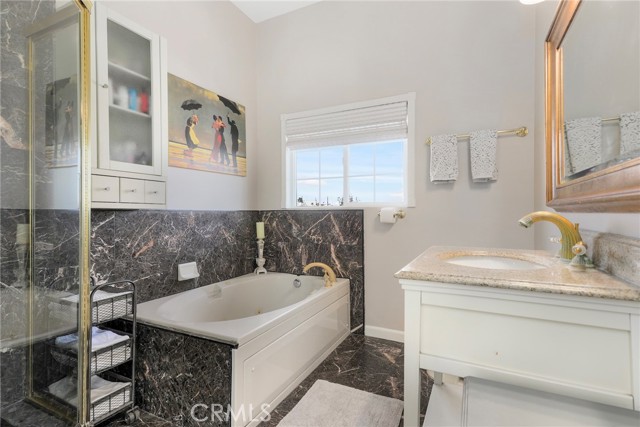 Don't miss your primary suite bathroom with soaking/jetted tub!