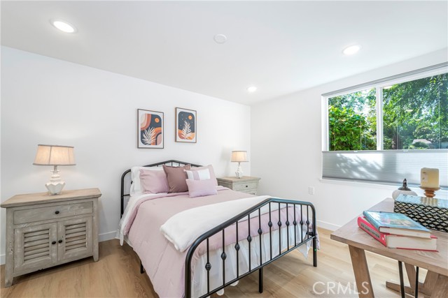 Large bedroom with lots of closet space and organizer, recessed lights in the room and in the closet as well as ceiling fan pre-wire.