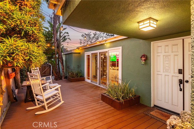 Entryway and side outdoor seating area