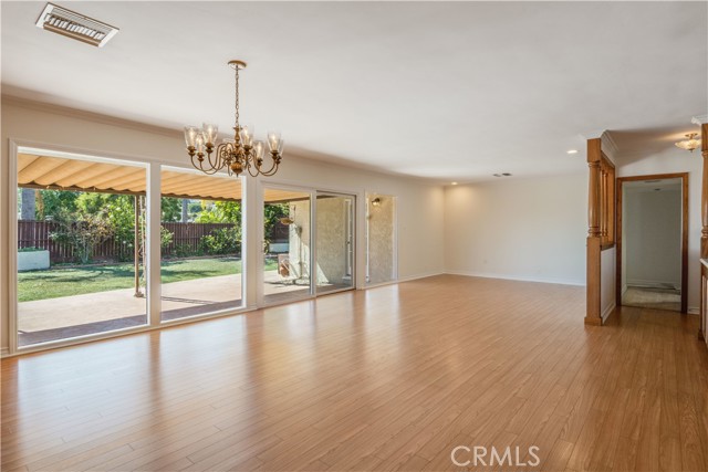 Beautiful wall of windows that brighten the living and dining rooms, and a view of the patio and yard.