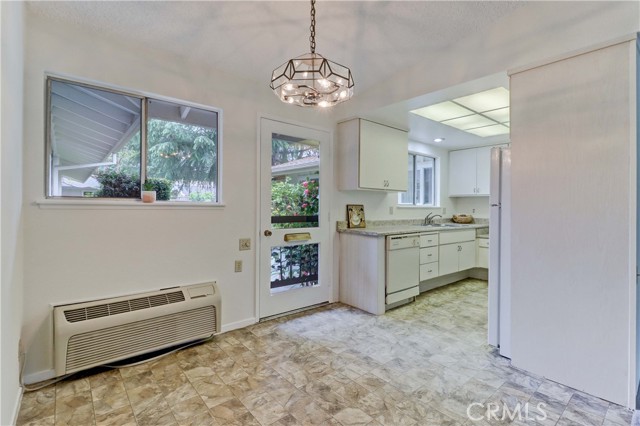 Dining room and kitchen with access to back door