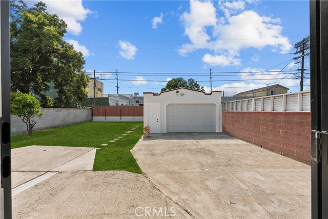 The backyard. The grass has been modified for marketing purposes.