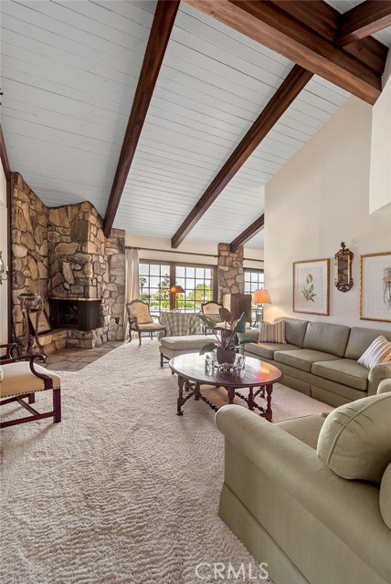 The high wood beams and open ceiling add to the spacious flow.