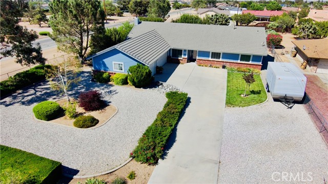 7475 Century Avenue Hesperia, California Beautiful single-story, open floor plan home in Hesperia featuring 3 spacious bedrooms 2 full baths and a half bath with a pristine pool and mature landscaping. This home is packed with all the features you need for entertaining a large family, including a formal dining room, family room/great room, living room, and breakfast nook. Master bedroom and bath is comprised of a garden tub, separate walk-in shower, and a large walk-in closet with a door out to your private HotSpring spa with remote. Kitchen features Baltic granite counters, with a newer french-door LG refrigerator that will be staying with the home. Washer and Dryer are negotiable. RV Parking - two entrances to back yard for RV. More recent upgrades include Anderson windows and doors, reengineered hardwood flooring, AC, heater unit and all the ducting.