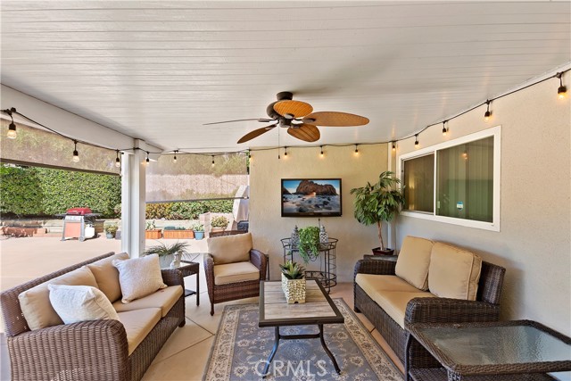 Outdoor Living Room - This covered patio is designed for outdoor living, dine alfresco and relax under the ceiling fan.