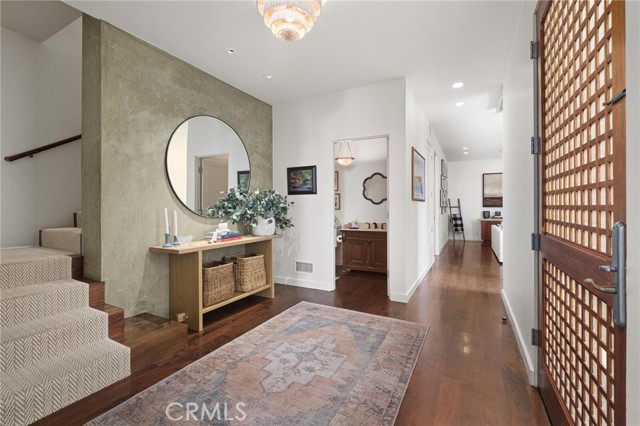 Entry and Venetian Plaster green wall which travels through the third floor